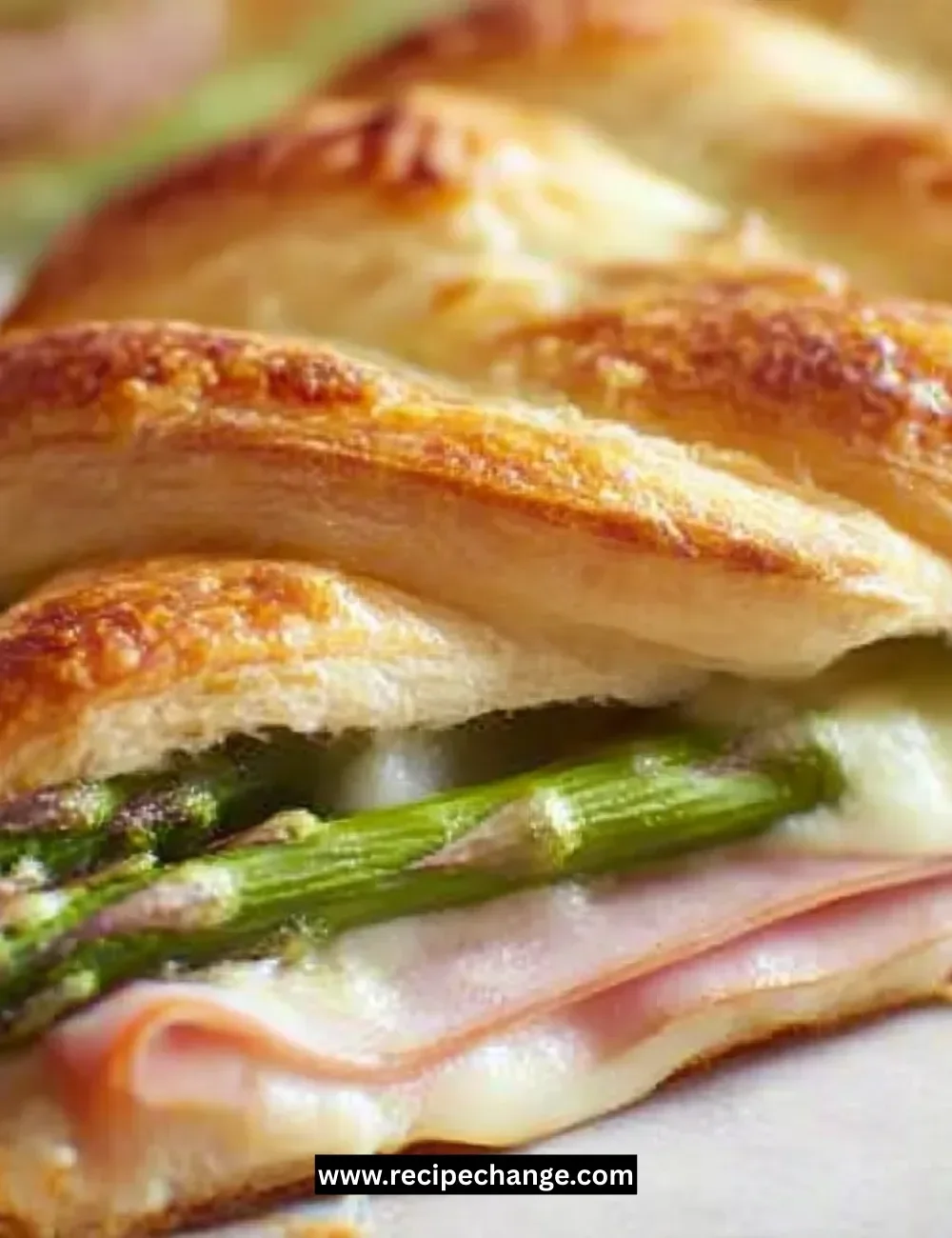 Asparagus pesto pasta served with roasted tomatoes on a plate