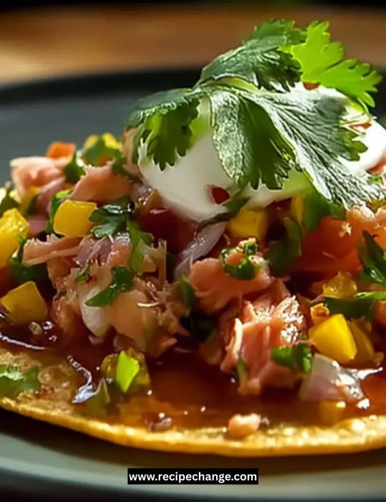 Delicious slice of Polish cheesecake topped with fruit and whipped cream