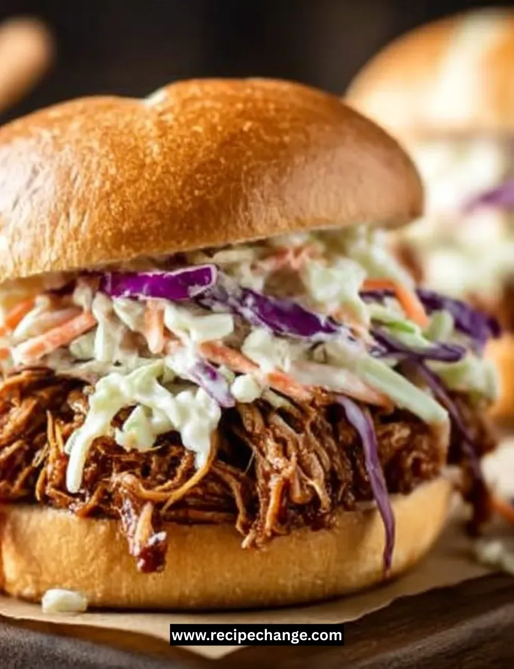 Freshly baked Parker House Rolls on a wooden table