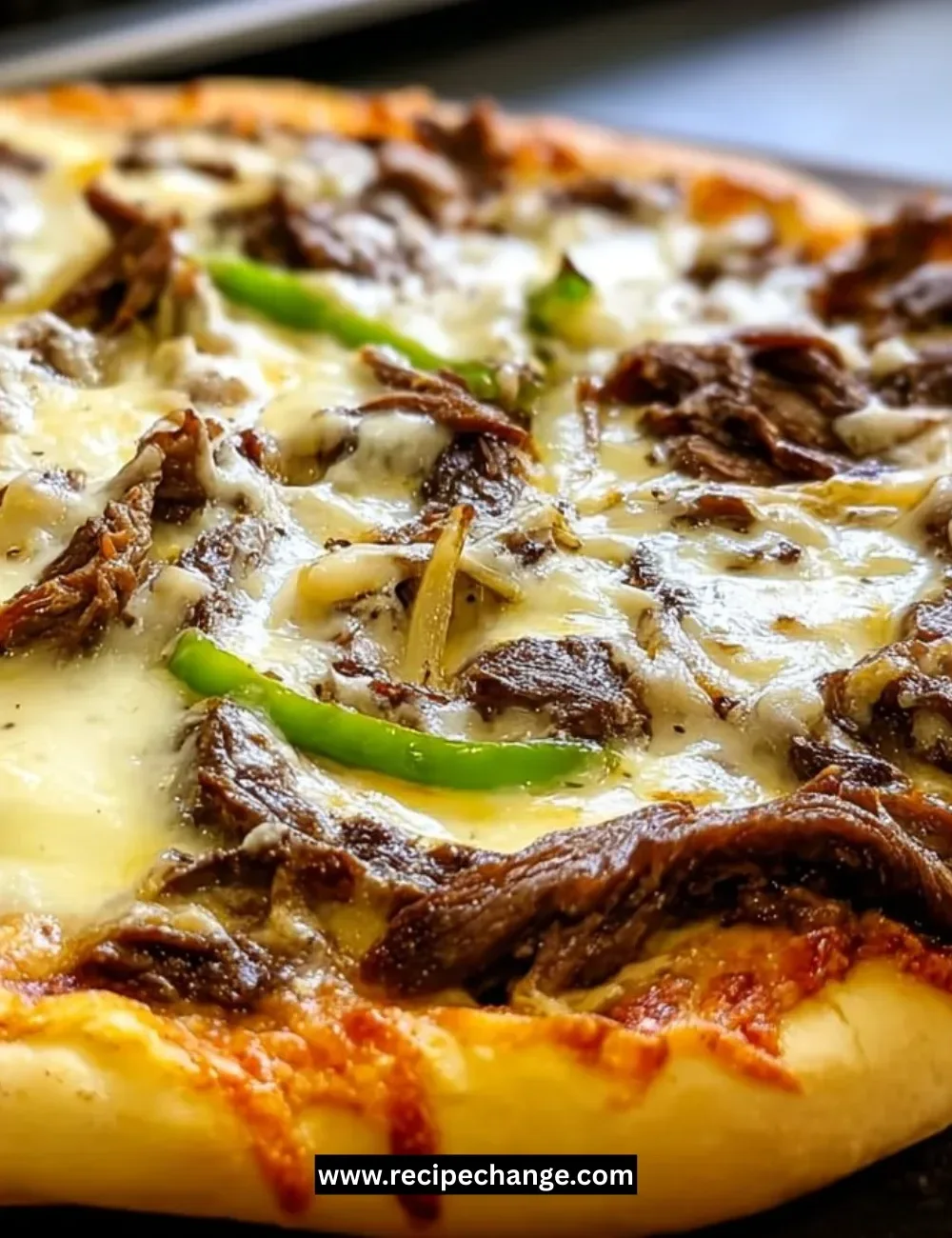 Sausage shrimp and veggies served over cheesy rice in a colorful dish