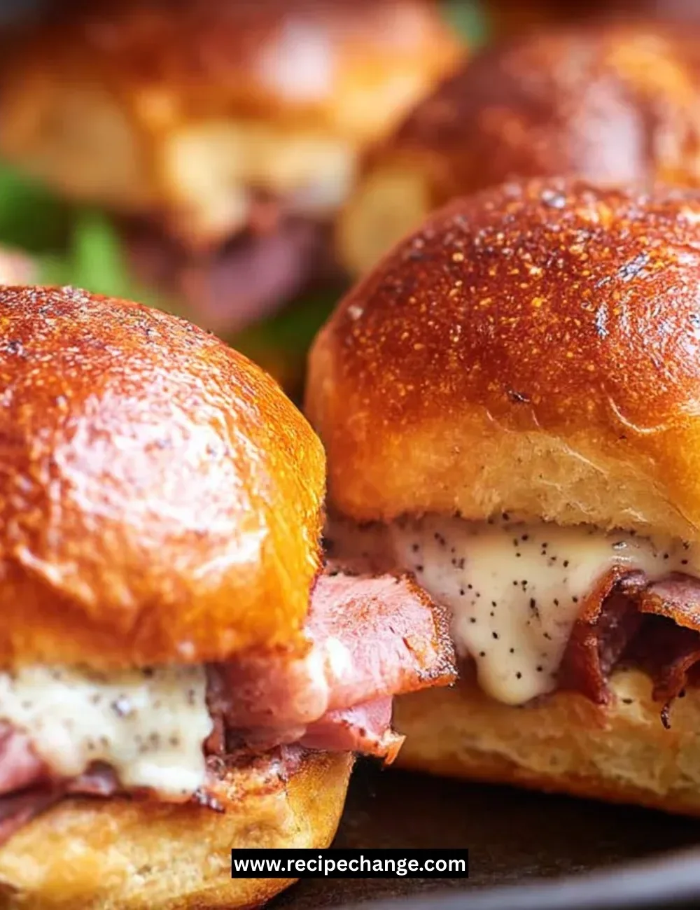 Tuna stuffed cheesy potatoes garnished with herbs and melting cheese