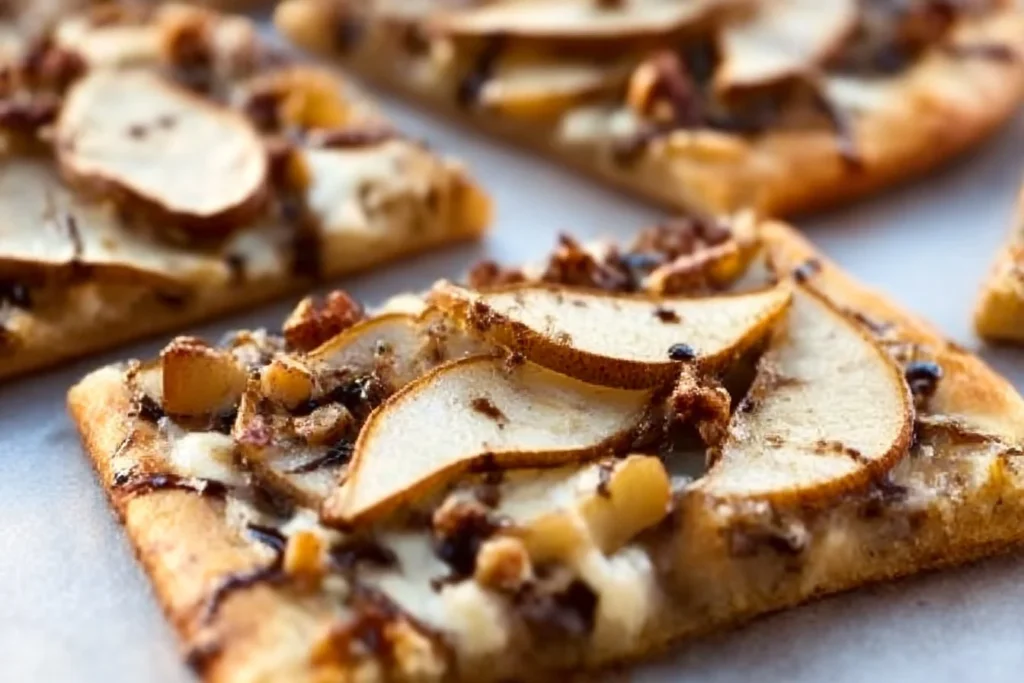 Plate of Spinach Sausage Alfredo Pasta garnished with fresh herbs