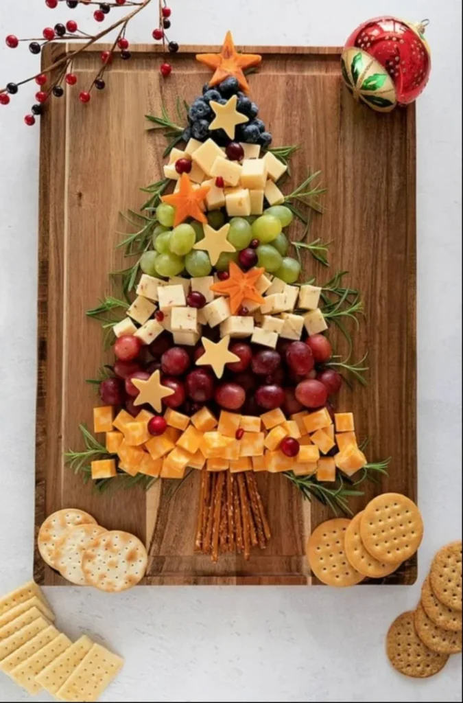 Festive Christmas Tree Charcuterie Board featuring assorted meats and cheeses.