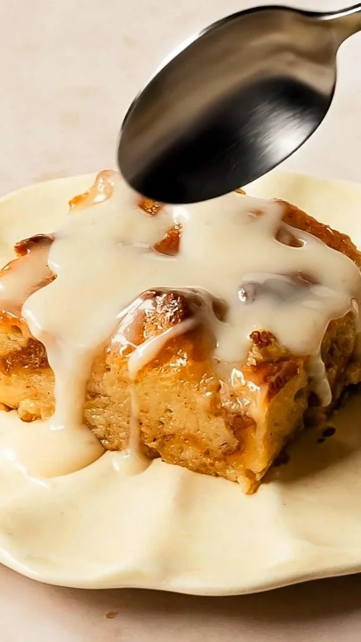 Delicious cinnamon bread pudding served with warm vanilla sauce