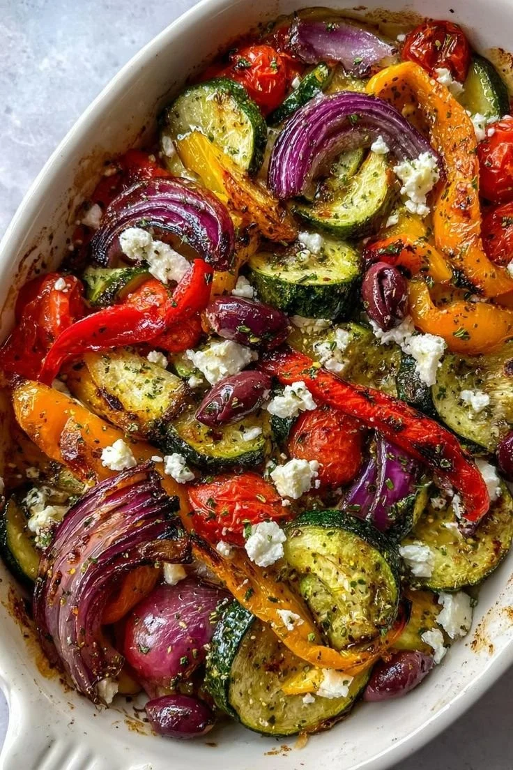 Colorful one-pan Greek vegetables featuring peppers, tomatoes, and herbs.