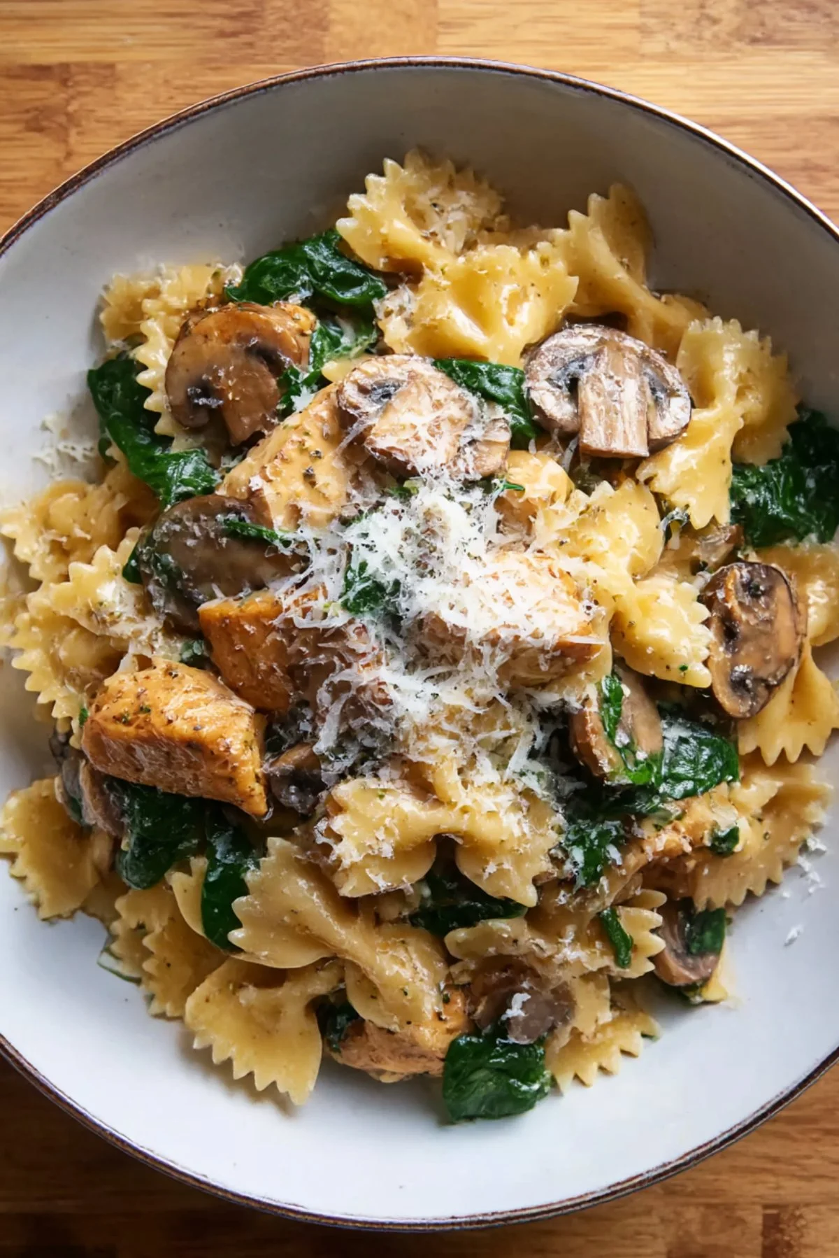 One-pot chicken and mushroom pasta dish served in a bowl