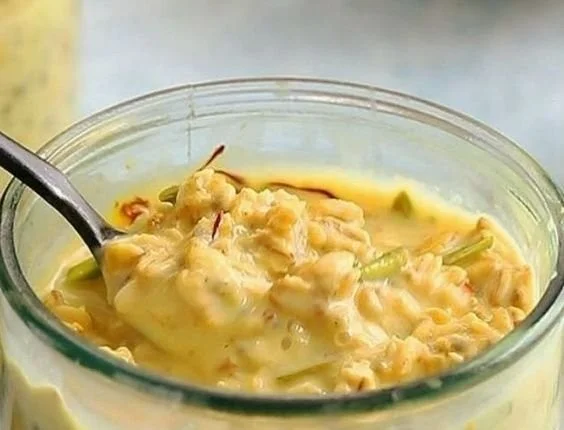 Delicious saffron overnight oats topped with fruits and nuts