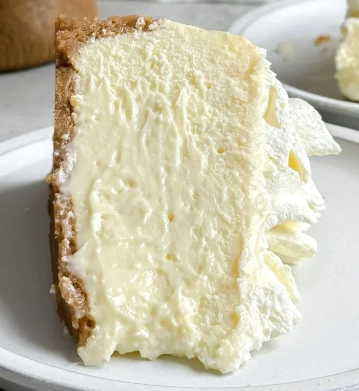 Ultimate cheesecake topped with fresh berries and whipped cream