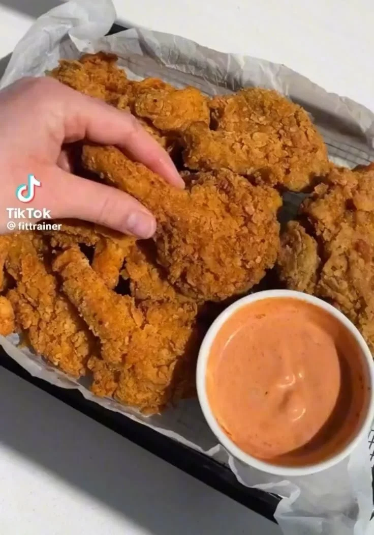 Plate of crispy Vegan Fried Chicken served with dipping sauce