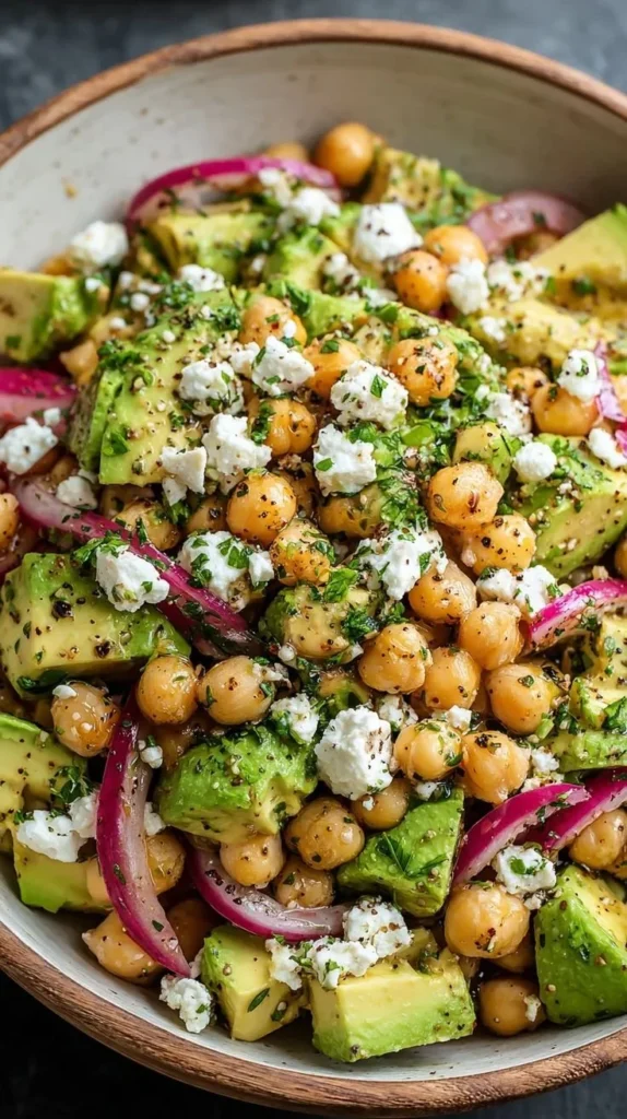 Chickpea Feta Avocado Salad with mixed greens and colorful vegetables