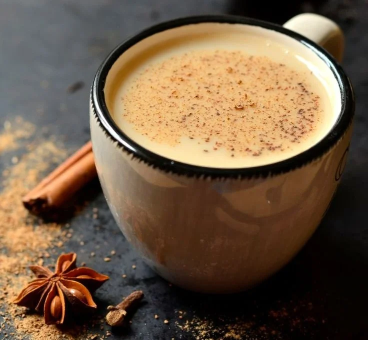 Cup of cinnamon tea with spices, promoting health and relaxation