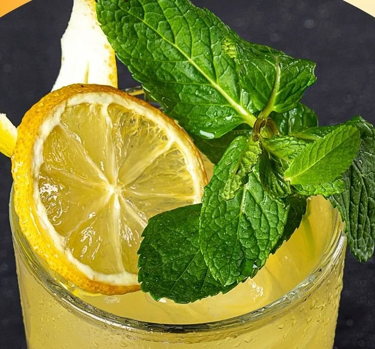 A refreshing glass of Flat Tummy Water with fresh ingredients for detox.