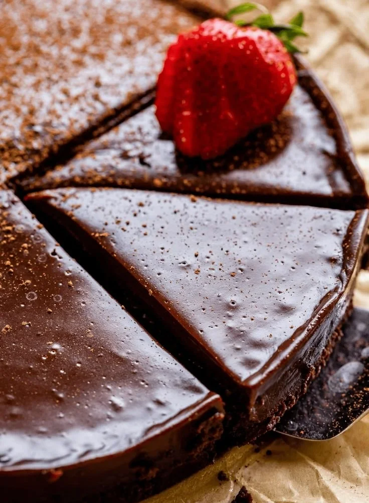 Delicious flourless chocolate cake served on a plate, perfect for dessert lovers