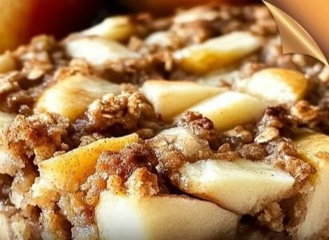 Warm Oatmeal Apple Breakfast Bake topped with fresh apples and spices