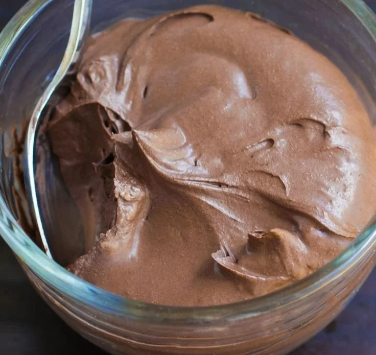 Delicious Vegan Chocolate Pudding served in a bowl, topped with fresh berries.