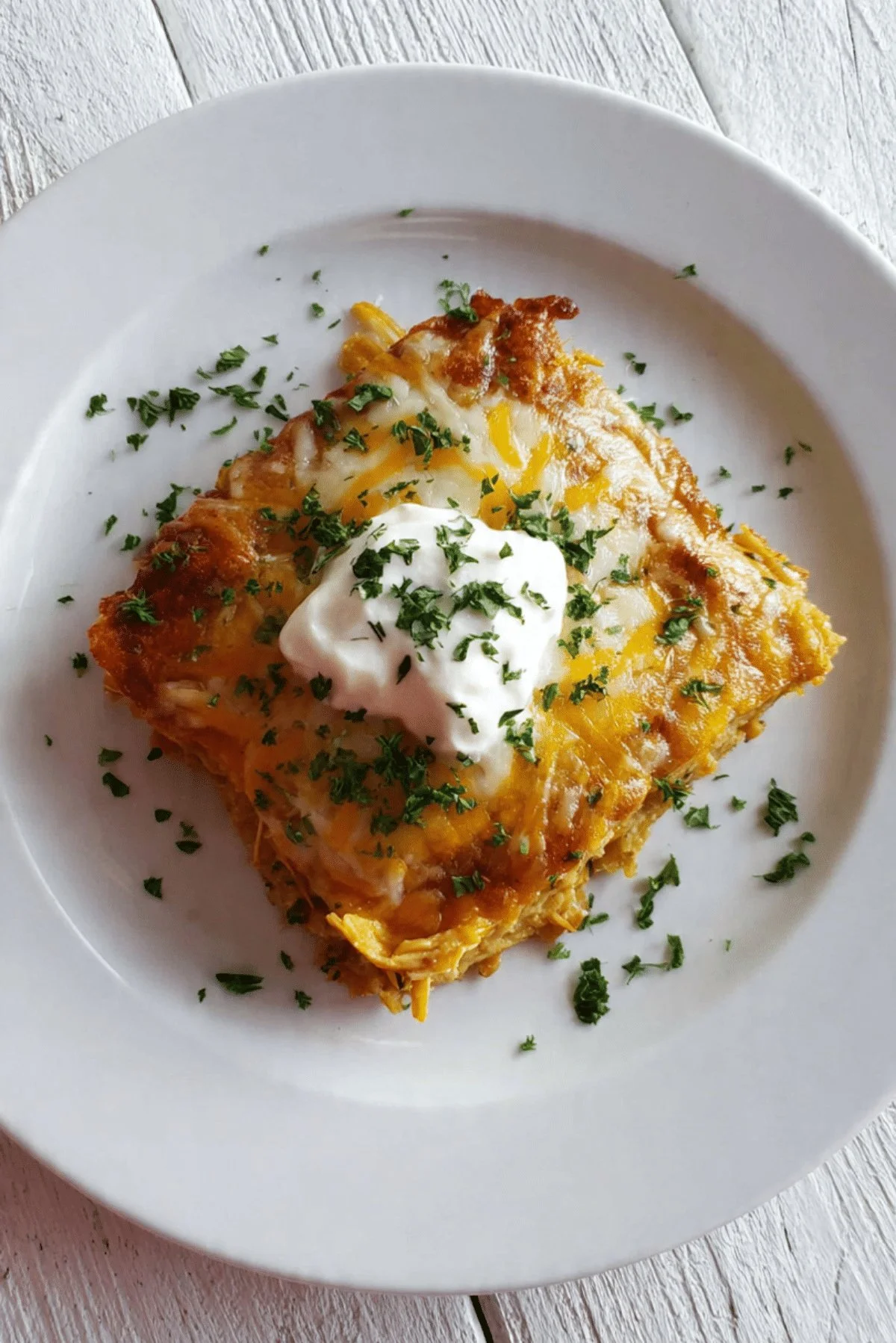 Delicious Chicken Tamale Casserole topped with cheese and garnished with cilantro