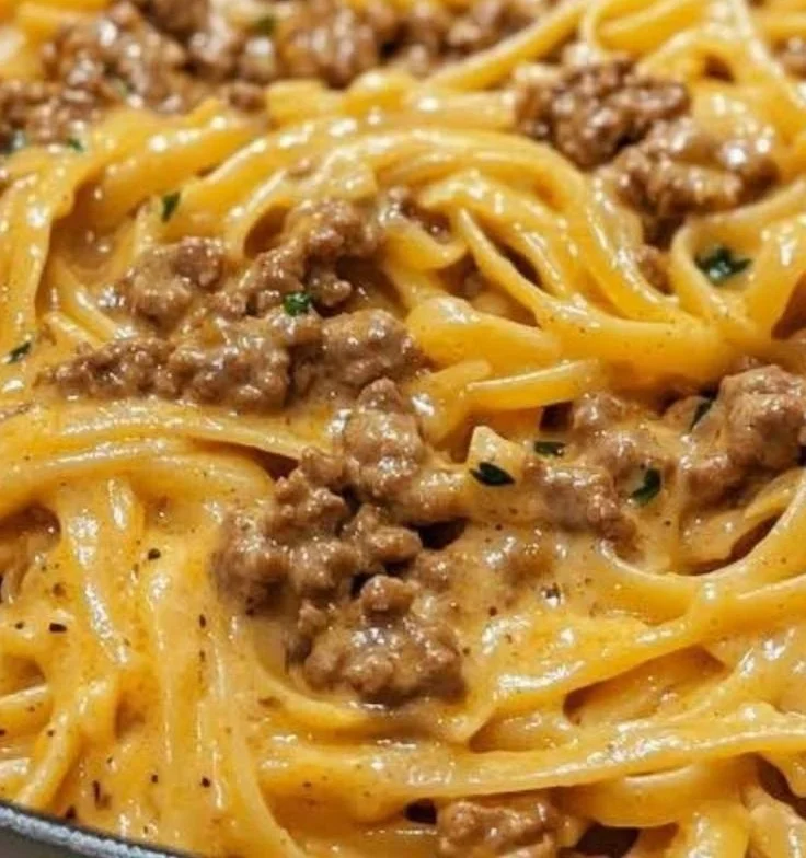 Creamy garlic butter pasta with ground beef served in a bowl