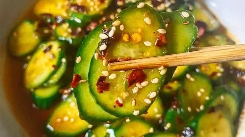 A vibrant bowl of easy Asian cucumber salad with fresh ingredients and dressing