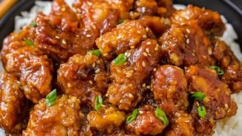 Delicious homemade General Tso's Chicken served with rice and broccoli
