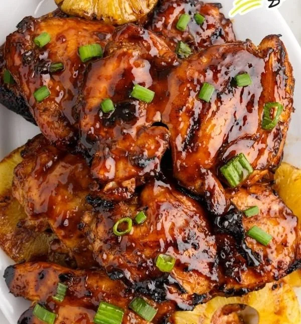 Delicious grilled Huli Huli Chicken marinated in a sweet and savory sauce