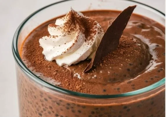 High protein chocolate chia seed pudding topped with fresh berries