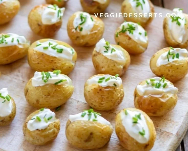 Delicious mini baked potatoes served on a platter