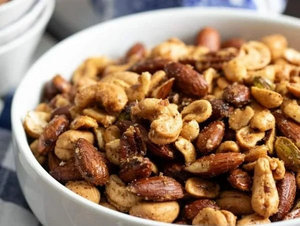 Bowl of flavor-packed spiced nuts ready to be enjoyed as a healthy snack.