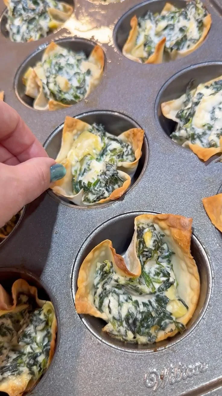 Savory spinach artichoke wonton cups, perfect for appetizers or party snacks.