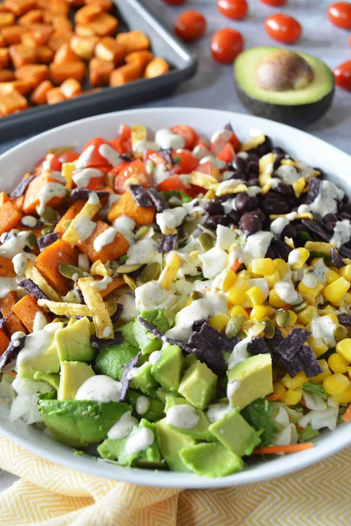 Roasted sweet potato taco bowl with fresh toppings and vibrant colors