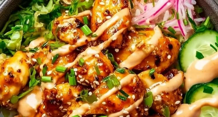 Delicious Bang Bang Chicken Bowl with succulent chicken and vibrant vegetables.