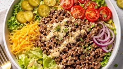 Big Mac style healthy burger bowl with vibrant ingredients and no bun.