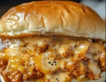 Cajun chicken sloppy joes served on a plate with toppings