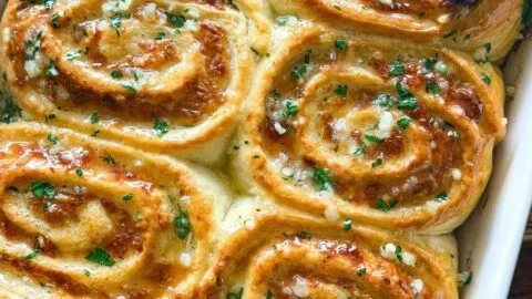 Freshly baked cheesy garlic rolls, golden and gooey with melted cheese and garlic.