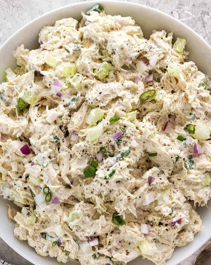 Delicious chicken salad with fresh ingredients in a bowl