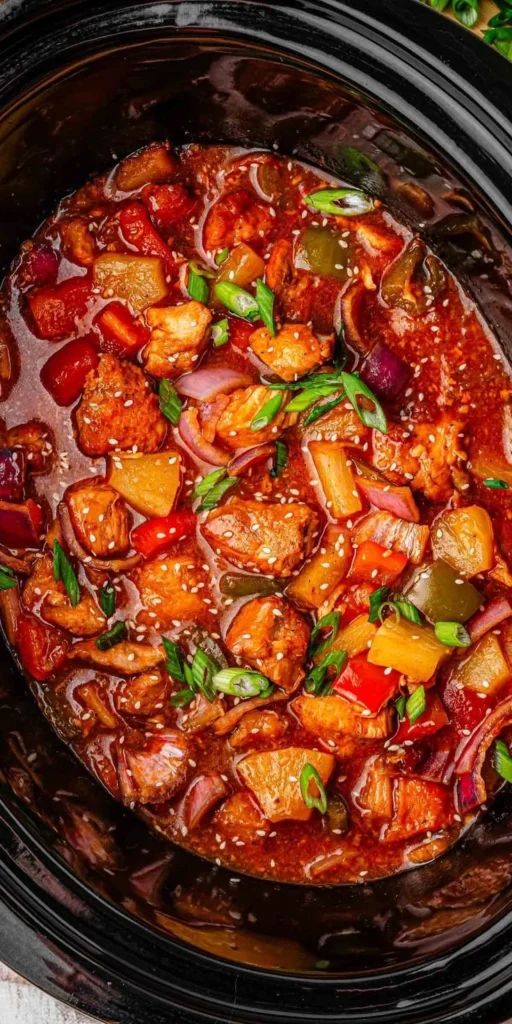 Delicious slow cooker sweet and sour chicken dish served over rice