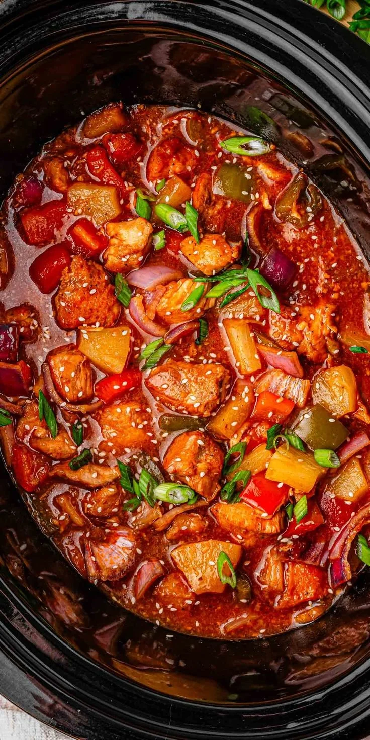 Delicious slow cooker sweet and sour chicken dish served over rice