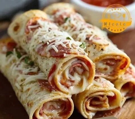 Delicious tortilla pizza rolls fresh out of the oven, crispy and topped with cheese.