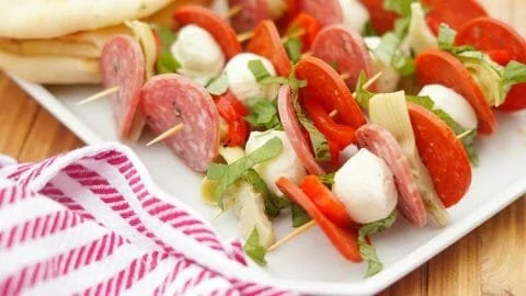 Delicious antipasto skewers featuring meats, cheeses, and vegetables.