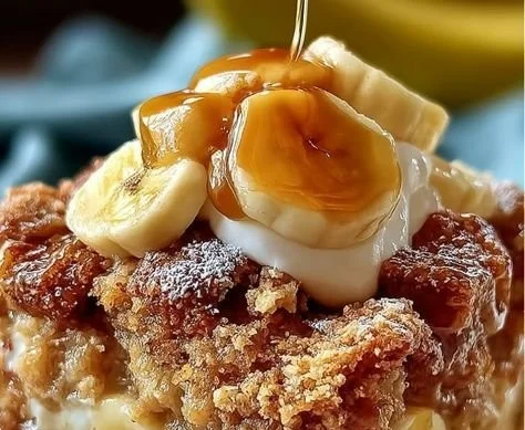 Homemade Banana Cobbler topped with golden brown crust and fresh banana slices