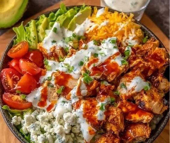 Buffalo Chicken Protein Bowl with spicy chicken, vegetables, and grains