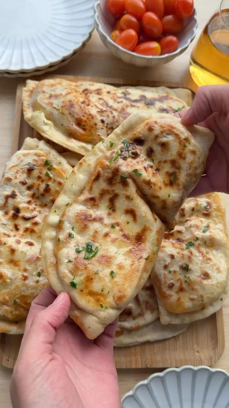 Delicious flatbread topped with creamy butter chicken and spices