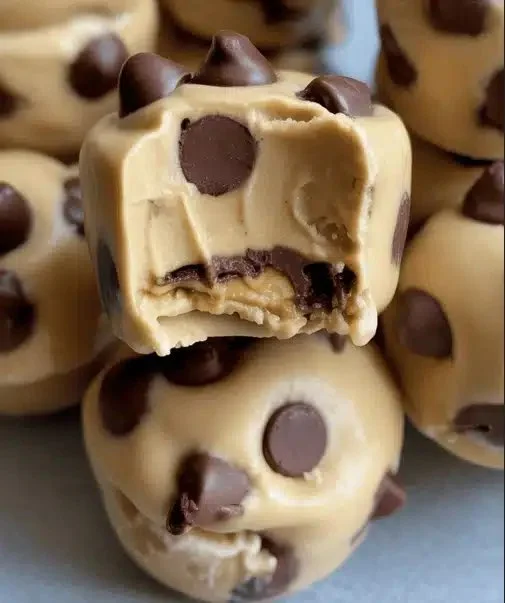 Frozen Greek yogurt peanut butter bites on a plate, a healthy frozen treat.