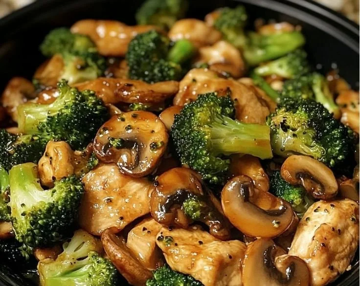Delicious chicken stir-fry with fresh broccoli and mushrooms in a savory sauce.