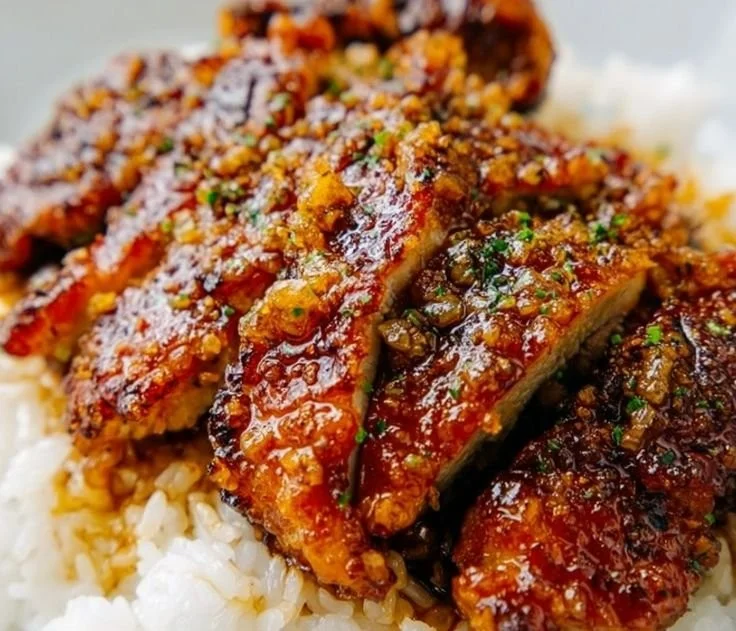 Plate of easy honey garlic chicken served with vegetables and rice