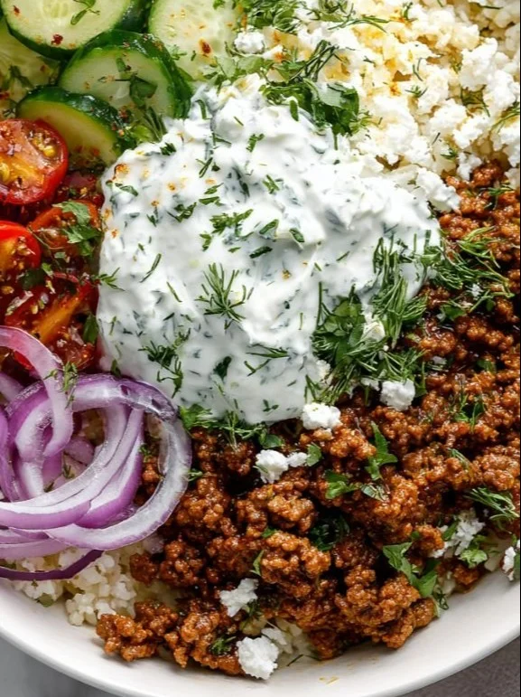 Greek Ground Beef Bowl with Tzatziki Sauce served in a vibrant bowl