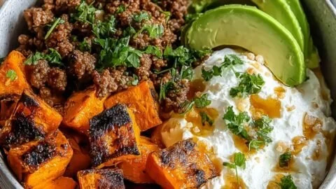 Viral Ground Beef Hot Honey Bowl topped with spicy honey sauce and fresh ingredients