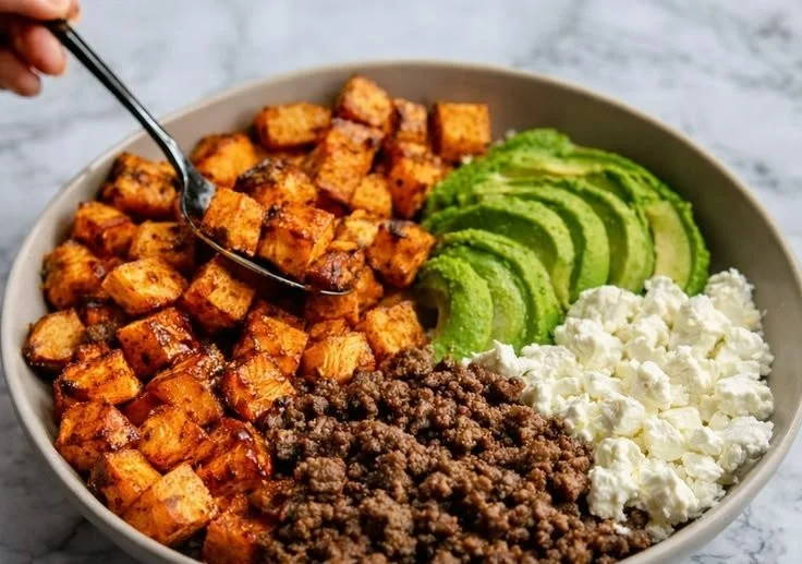 Hot Honey Beef Bowls with Sweet Potatoes on a vibrant plate.