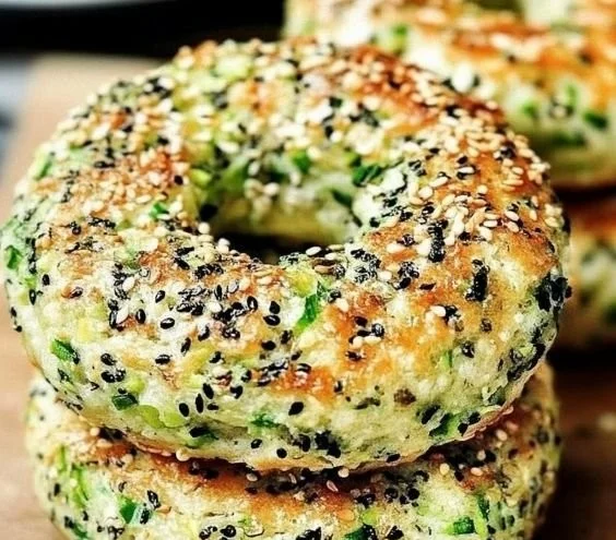 Homemade zucchini bagels topped with sesame seeds, fresh from the oven